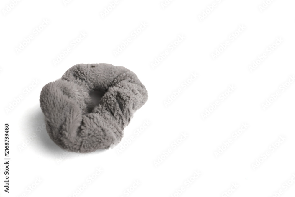 Fototapeta premium Gray Fluffy Hair Scrunchie on White Background, Close-Up Shot
