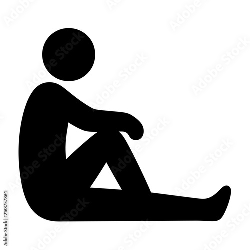 Black silhouette of a person sitting cross-legged on the ground with arms resting on knees.