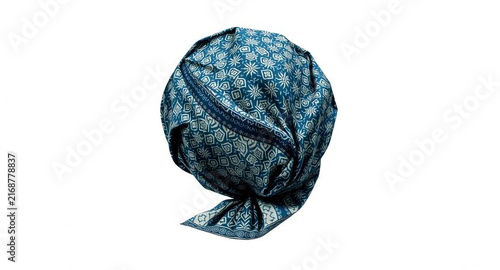 Blue batik patterned head wrap turban, traditional printed fabric headscarf, isolated on white background