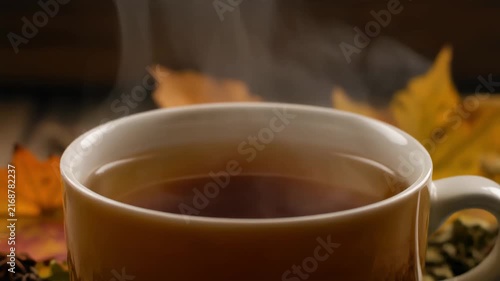 Steam rising from autumn herbal tea