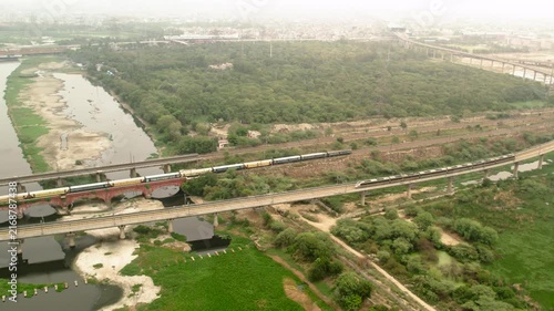 Aerial view of expressway construction and railway bridge in New Delhi, India