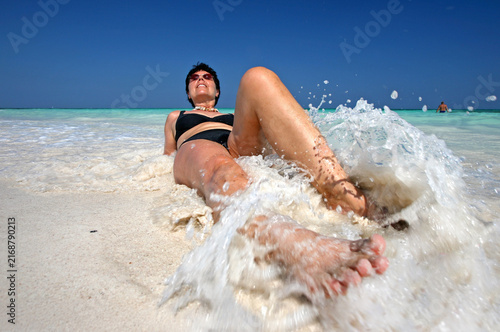 woman on a Tropical Beach in Mexico with Crystal Clear Turquoise Water