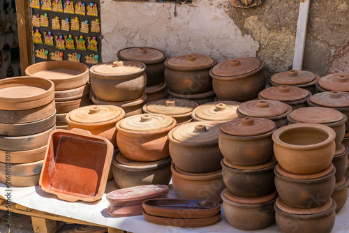 Traditional pottery displayed in Cappadocia market. Concept of craftsmanship, culture, heritage, authenticity and sustainable native tourism commerce.