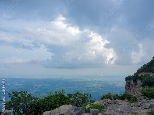 Obraz na płótnie Look down upon the vast plains from the mountaintop time lapse clouds over the b