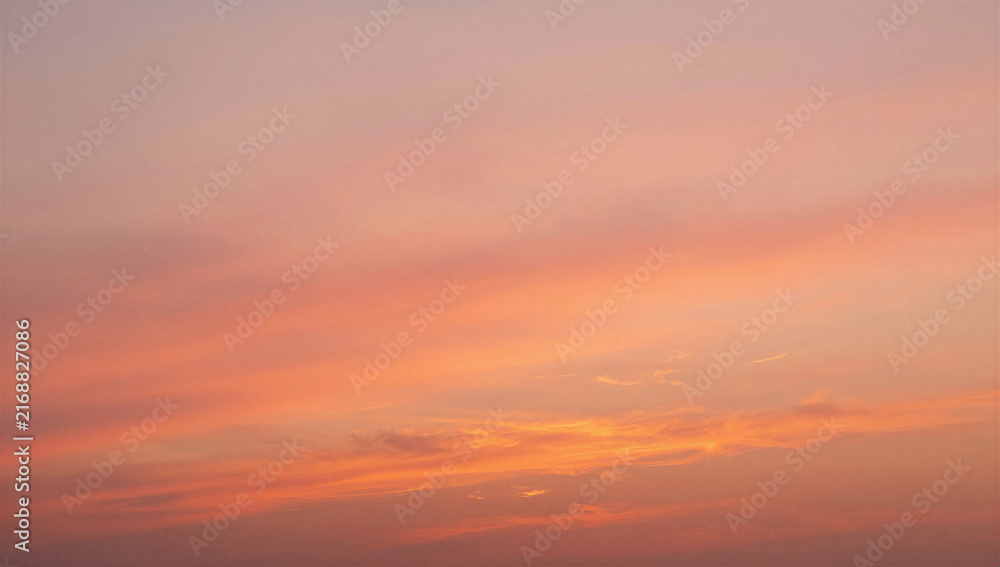 Fototapeta premium Serene sunset sky with soft pink and orange hues during twilight 