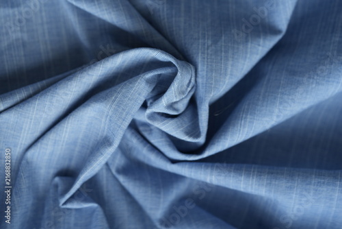 Light blue cotton fabric with soft folds background
