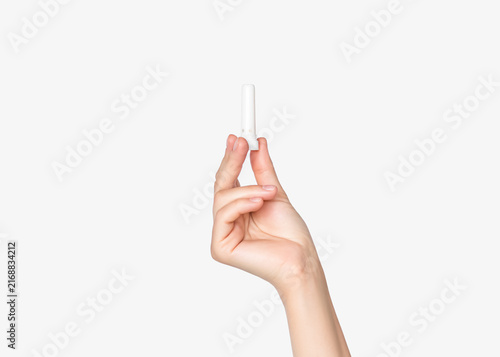 Hand Holding Small White Plastic Nasal Inhaler On White Background