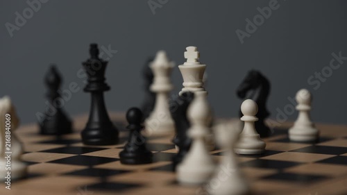 chess on a wooden board going around in circle