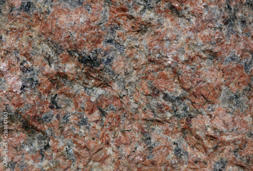 Obraz na płótnie unpolished red granite stone close-up