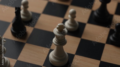 chess on a wooden board going around in circle