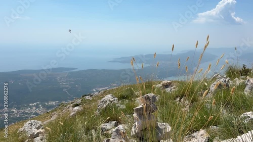 Majestic mountains overlooking the blue sea on a sunny summer day, scenic Mediterranean coastal landscape under a clear sky