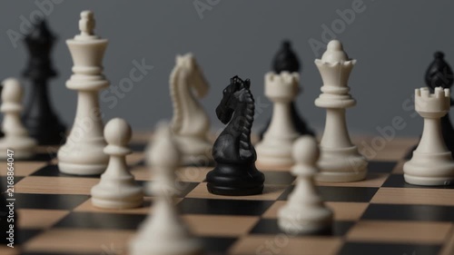 chess on a wooden board going around in circle