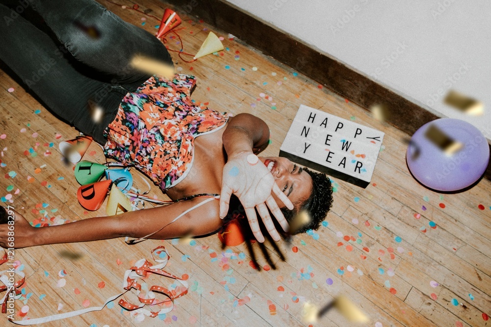 Naklejka premium Happy woman on the floor at a party