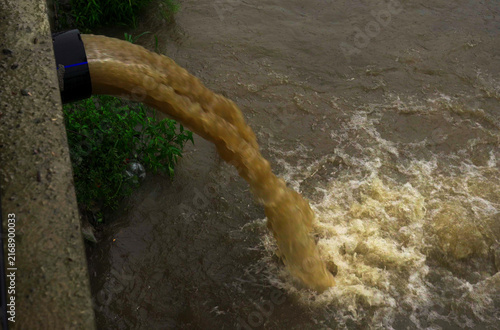 Contaminated water runoff causing environmental harm in local river