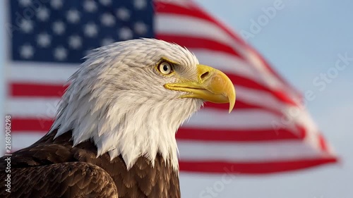 Bald eagle with eyes closed in a peaceful moment, positioned in front of a waving american flag