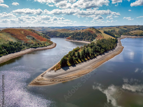 Aerial view of the very low water level in the Llyn Clywedog reservoir in mid Wales due to heatwaves in the UK in summer 2026. No people.