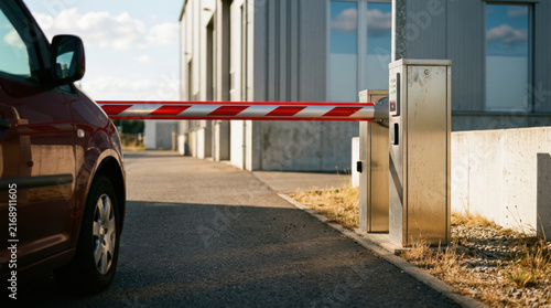 Automated Barrier Gate Restricts Vehicle Access To Modern Building Exterior