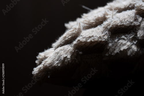 A sheepskin-textured pillow in bright ambient light