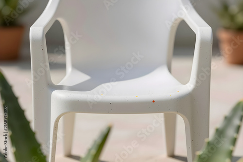 Extreme close-up of a speckled recycled plastic surface catching the light.