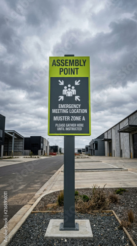 Assembly Point Sign In New Industrial Area Under Cloudy Sky