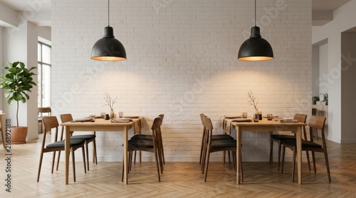 Modern cafe interior with white brick wall and wooden tables.