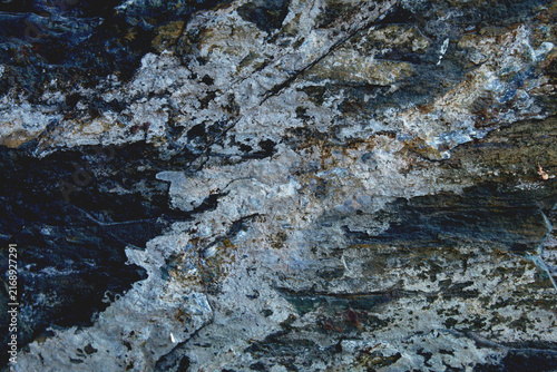 Fotografie Grungy blue grey sedimentary rock texture with white mineral crusts and deep cre