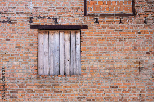 Wooden window on brick wall in an old building during daylight