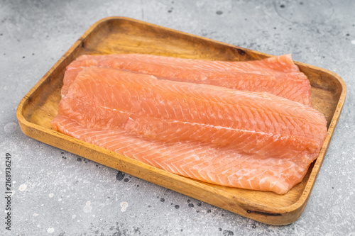 Bild auf Leinwand Fresh raw salmon fillet Salmo salar on wooden board
