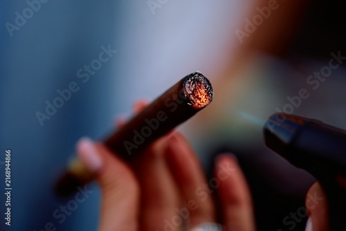 Konstfotografi Lighting a Cigar with a Torch Lighter