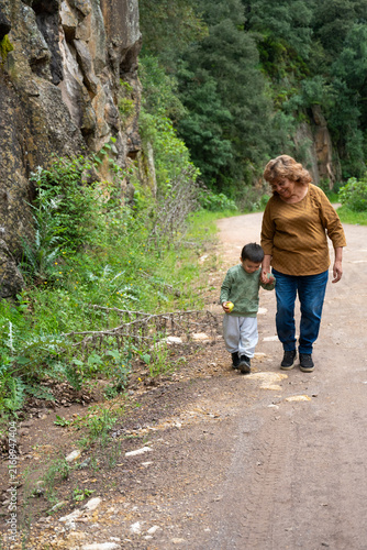 Woman and child happily exploring a forest trail in Mineral del Chico.