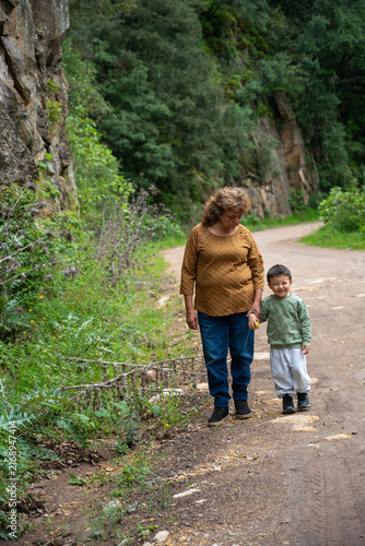 Woman and child exploring a forest trail in Mineral del Chico.