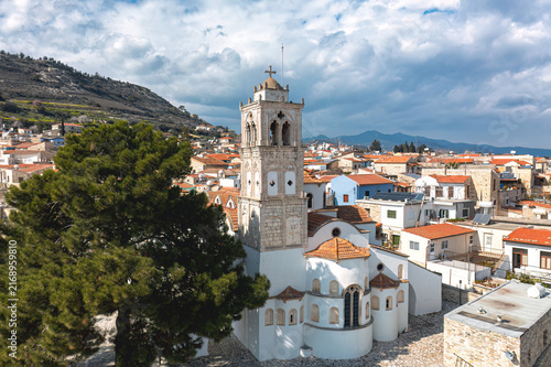 White chPano Lefkara village, surrounded by traditional houses and a mountain landscape under a cloudy sky. Larnaca District, Cyprus