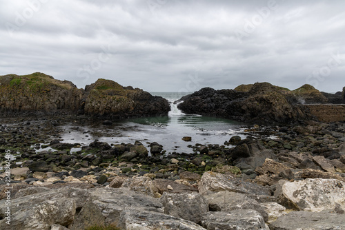 Natural coastal beauty at Ballintoy Point in Northern Ireland with cloudy sky