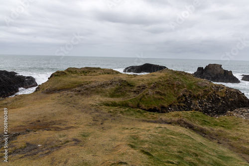 Natural coastal beauty at Ballintoy Point in Northern Ireland with cloudy sky