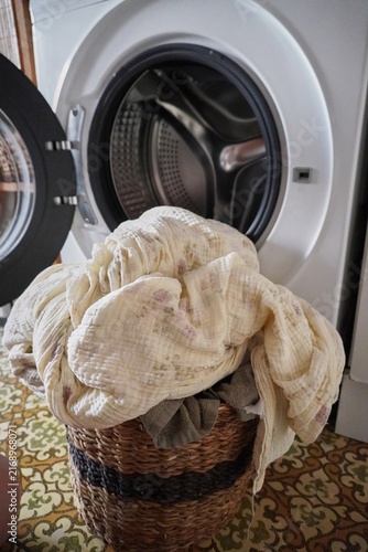 Canvastavla Laundry Routine: Washing a Pile of Clothes in Front of an Open Washing Machine D