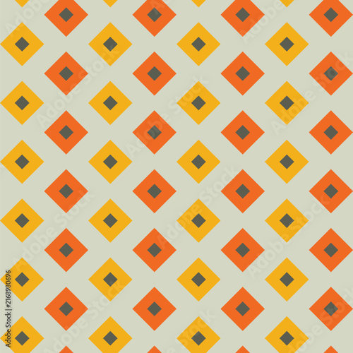 Seamless pattern created from small dark khaki diamonds in larger goldi and orange diamonds on a pale green background