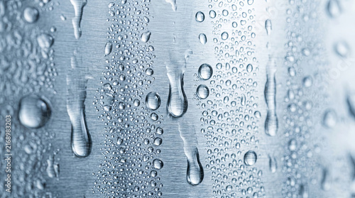 Condensation water droplets on brushed metal surface