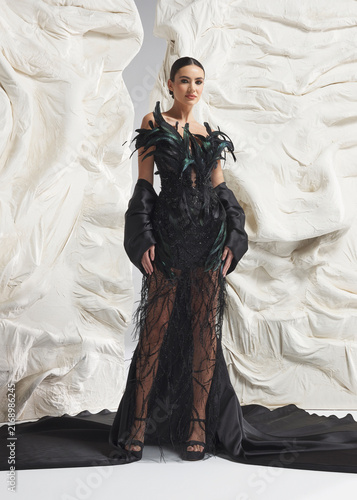 Canvastavla Full length shot of elegant woman wearing luxury black sheer lace gown with dram