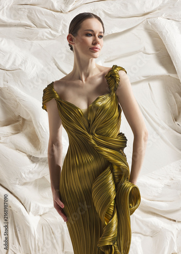 Fotografie Editorial fashion view of elegant woman wearing luxury chartreuse gold pleated l