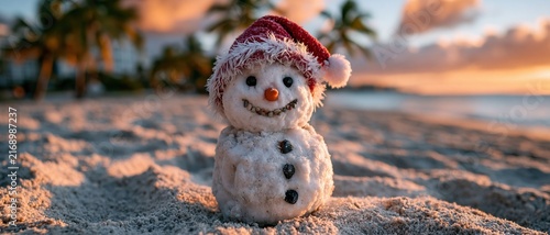 Sand Snowman in Red Hat on Beach
