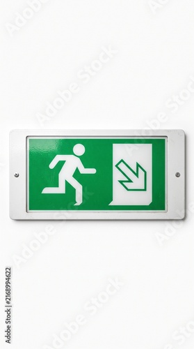 Emergency exit sign with running person and arrow pointing down