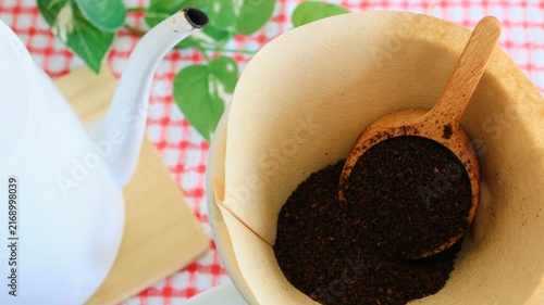 Pour-Over Coffee Preparation with Ground Coffee and Kettle