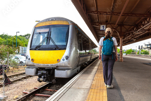 Fotografie Female Tourist with Diesel Train at Royal Leamington Spa Railway Station, Warwic