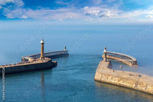 Whitby Harbour Piers with Lighthouses in Whitby, England, UK