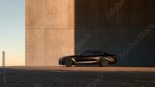 Cinematic coupe parked beside modern concrete wall