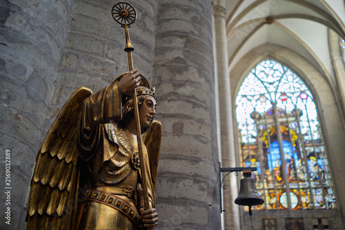 Gilded Statue of an Angel with a Staff Inside Cathedral in Brussels, Belgium