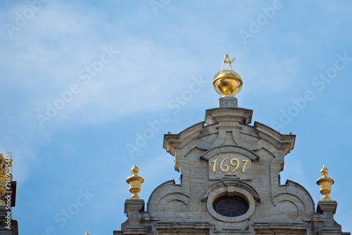 Gilded Year 1697 Inscription and Rooftop Detail in Grand Place of Brussels, Belgium