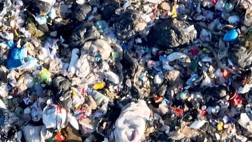 Flock of Birds Flying Over Massive Landfill with Exposed Waste and Garbage. Biguaçu, Santa Catarina, Brazil. Aerial View.