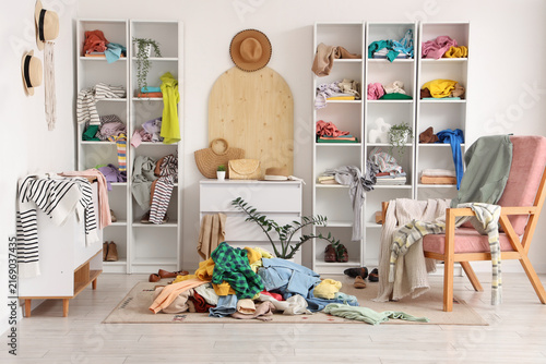 фотографія Messy room and disorganized closet clutter and chaos in home spring cleaning and