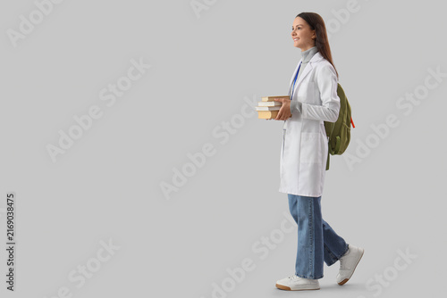 Medical education and healthcare career path, young female student in lab coa...